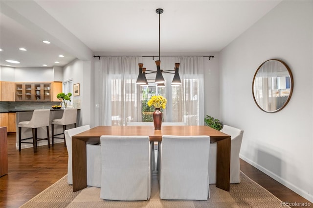 dining room featuring a chandelier and hardwood / wood-style floors