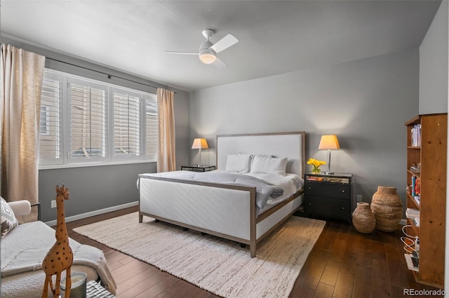 bedroom with ceiling fan and dark hardwood / wood-style flooring