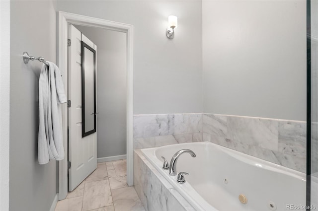 bathroom with tiled tub