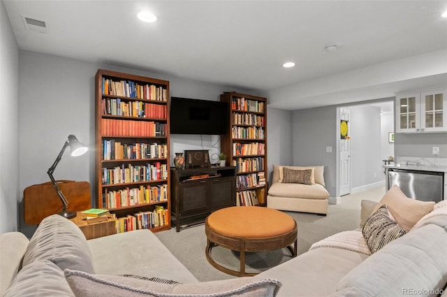 living room featuring light carpet