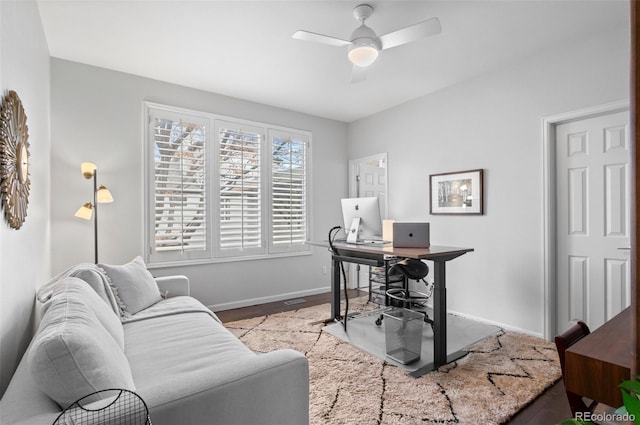 office featuring ceiling fan and light hardwood / wood-style flooring