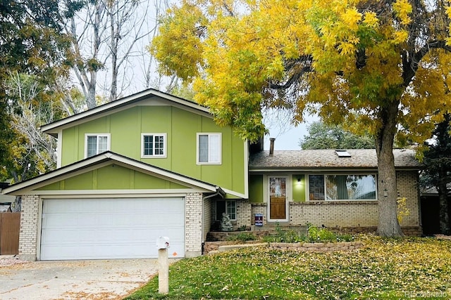 split level home with brick siding and an attached garage