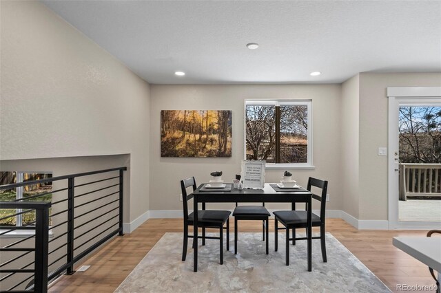 8334 Allison Ct, Arvada, CO 80005 - dining room featuring wood finished floors, baseboards, and recessed lighting