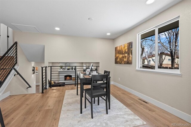 8334 Allison Ct, Arvada, CO 80005 - dining area with wood finished floors, baseboards, and recessed lighting