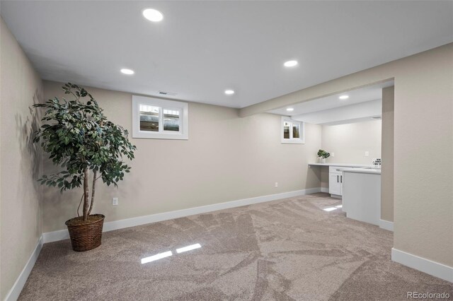 8334 Allison Ct, Arvada, CO 80005 - basement with light carpet, recessed lighting, and baseboards