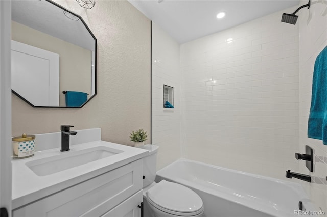 8334 Allison Ct, Arvada, CO 80005 - full bathroom featuring toilet, a textured wall, vanity, and shower / bathtub combination