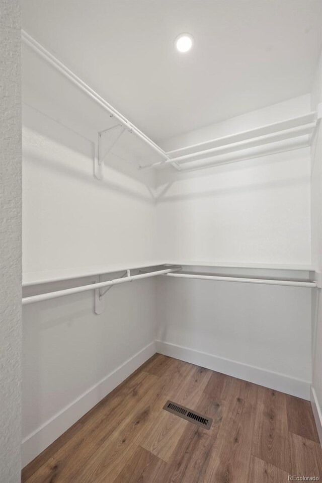 8334 Allison Ct, Arvada, CO 80005 - spacious closet featuring wood finished floors