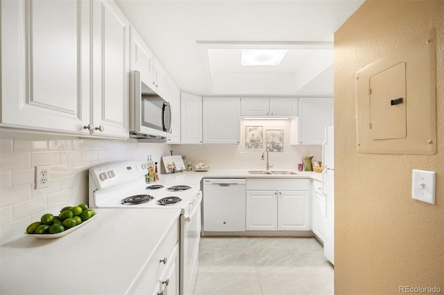 kitchen with sink, tasteful backsplash, electric panel, white appliances, and white cabinets