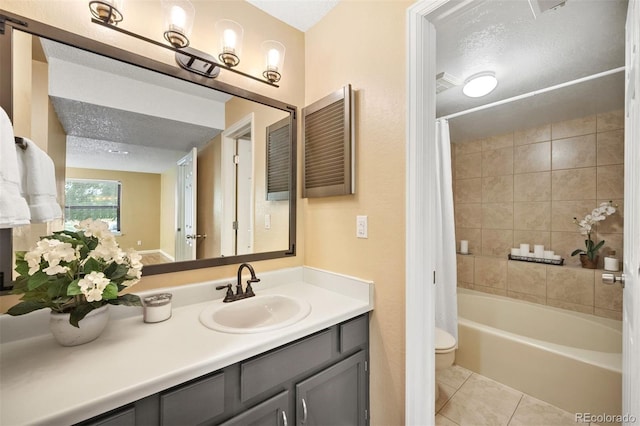 full bathroom featuring shower / bath combo, tile patterned flooring, vanity, a textured ceiling, and toilet