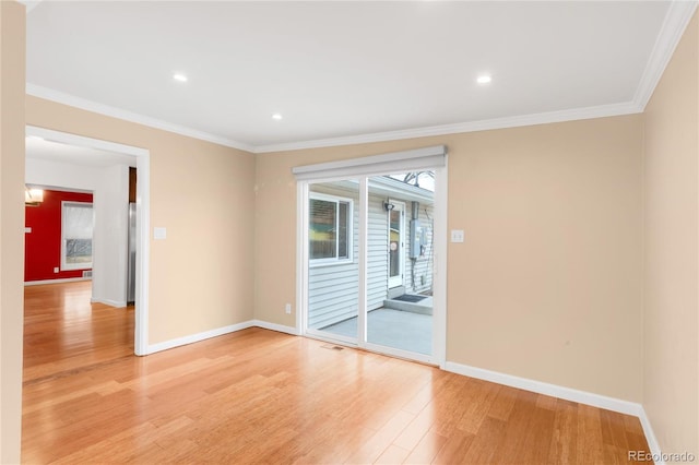 empty room featuring recessed lighting, baseboards, light wood-style floors, and crown molding