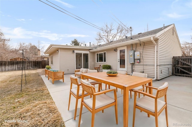 back of property featuring an outdoor hangout area, fence, outdoor dining space, and a patio area