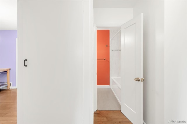 hallway with wood finished floors