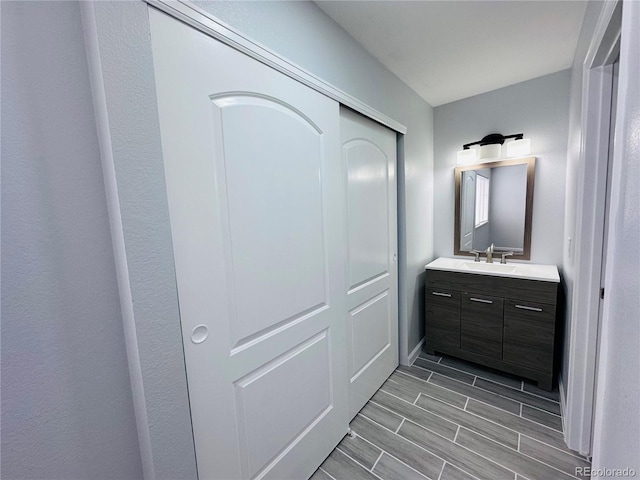 bathroom featuring vanity and wood tiled floor