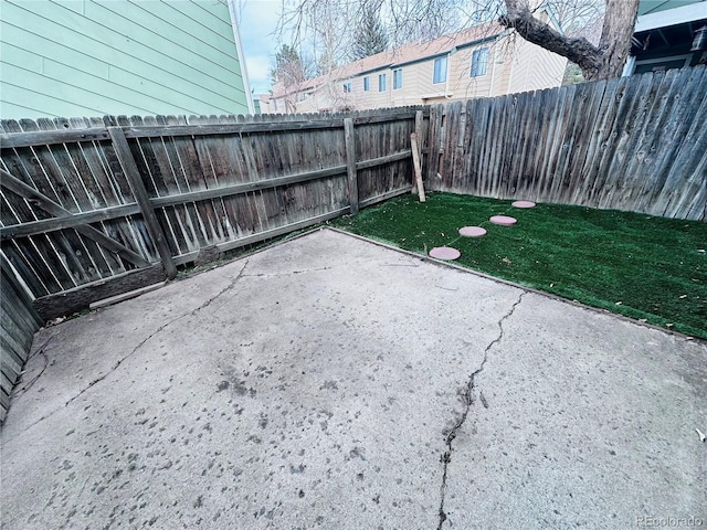 view of yard with a fenced backyard and a patio area