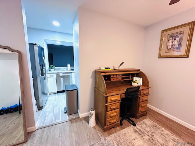 office space with recessed lighting, light wood-style floors, baseboards, and ceiling fan