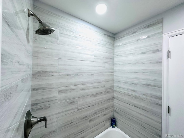bathroom with shower / washtub combination