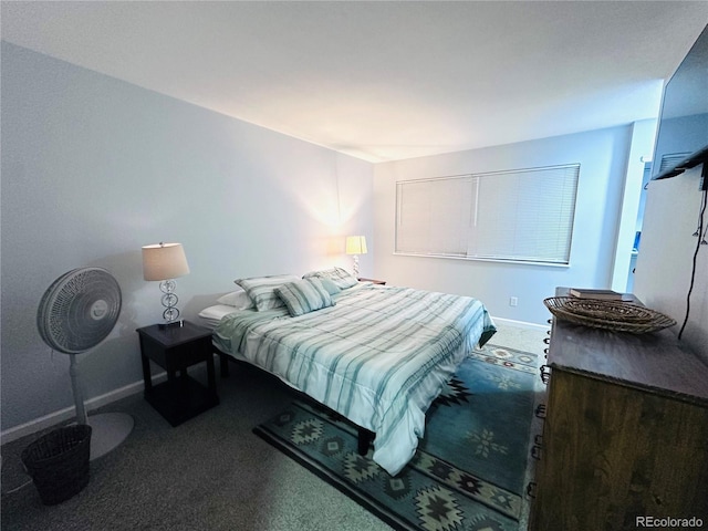 carpeted bedroom with baseboards