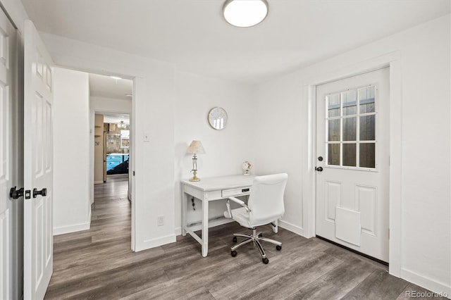 home office with hardwood / wood-style flooring