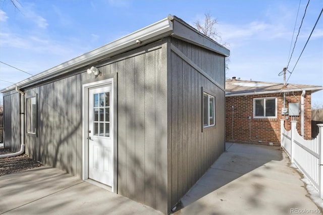 view of side of home with a patio