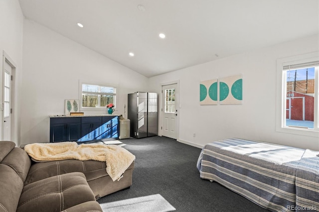 bedroom with lofted ceiling and dark carpet