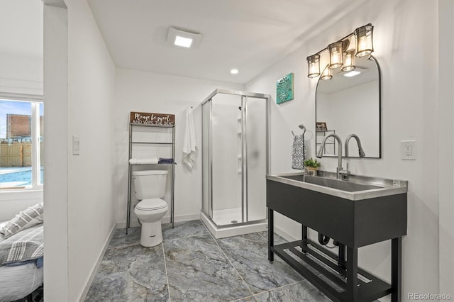 bathroom featuring toilet and walk in shower