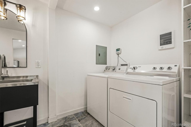 laundry room featuring electric panel and independent washer and dryer