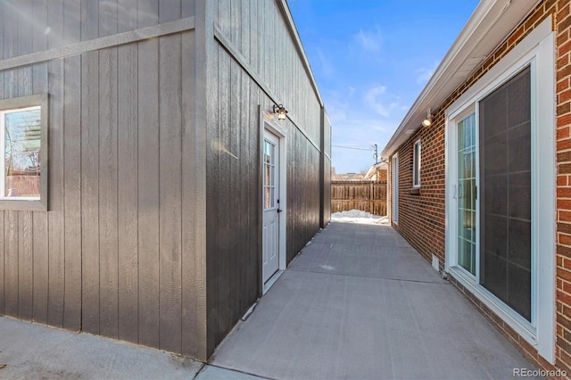 view of side of property featuring a patio area