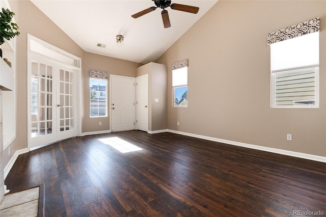 empty room with ceiling fan, dark hardwood / wood-style floors, and high vaulted ceiling