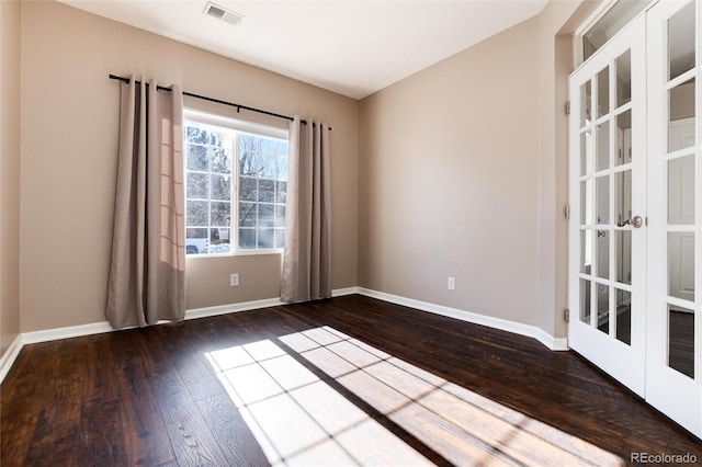 unfurnished room with dark hardwood / wood-style floors