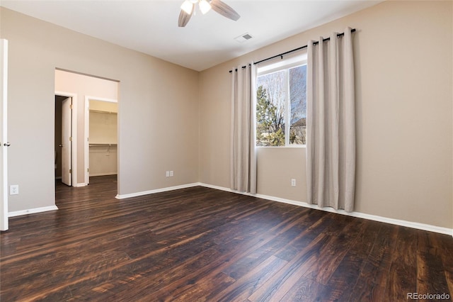 unfurnished room featuring dark hardwood / wood-style flooring and ceiling fan