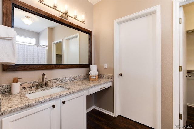 bathroom featuring a shower with curtain, vanity, and hardwood / wood-style floors