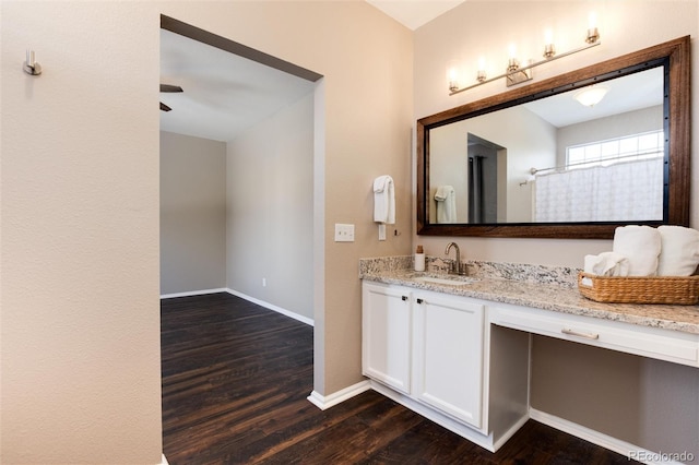 bathroom with vanity and hardwood / wood-style floors