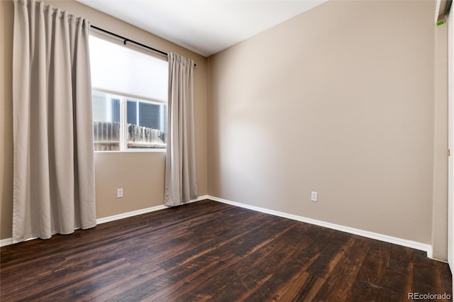 empty room featuring dark wood-type flooring