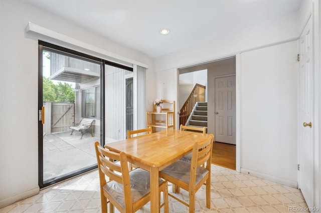 1254 S Yosemite Way Unit 99, Denver, CO 80247 - dining area featuring recessed lighting, baseboards, and stairs