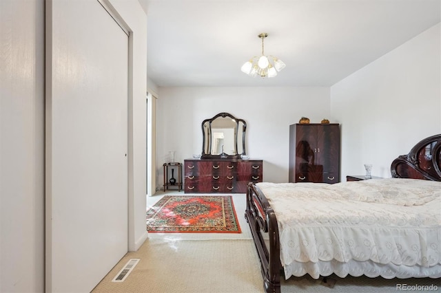 1254 S Yosemite Way Unit 99, Denver, CO 80247 - bedroom with carpet and a chandelier