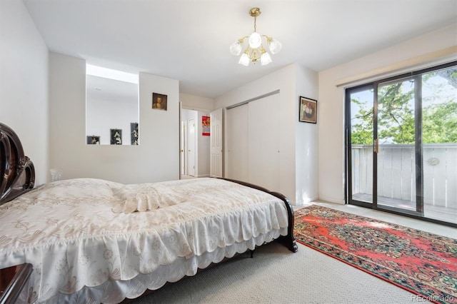 1254 S Yosemite Way Unit 99, Denver, CO 80247 - bedroom with access to exterior, a chandelier, a closet, carpet flooring, and baseboards