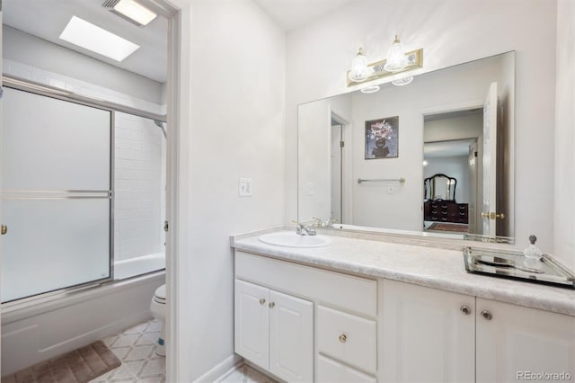 1254 S Yosemite Way Unit 99, Denver, CO 80247 - full bathroom with toilet, vanity, and shower / bath combination with glass door
