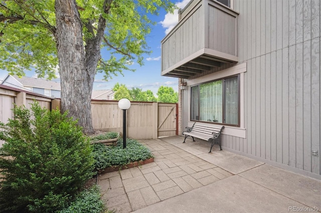 1254 S Yosemite Way Unit 99, Denver, CO 80247 - fenced backyard featuring a patio and a balcony