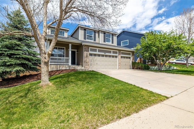 view of front of home featuring an attached garage, a front yard, brick siding, a porch, and driveway
