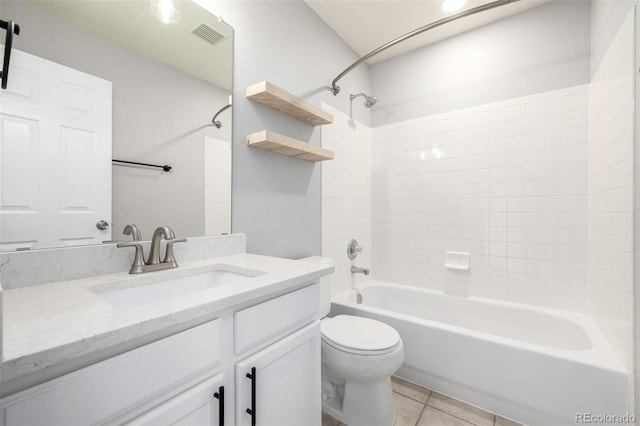 bathroom with visible vents, vanity, tile patterned floors, toilet, and  shower combination