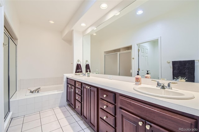 bathroom featuring tile patterned floors, plus walk in shower, and vanity