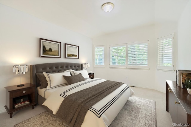 bedroom featuring light colored carpet