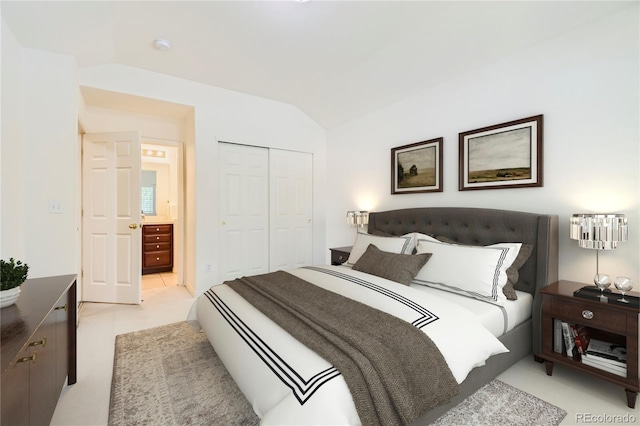 bedroom with a closet and lofted ceiling