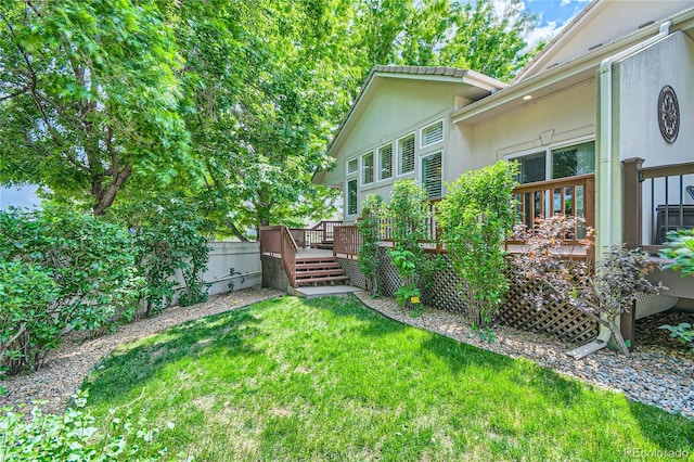 view of yard featuring a wooden deck