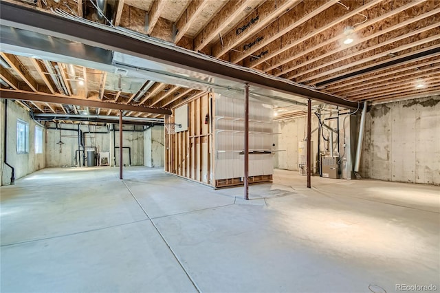 basement with heating unit and water heater