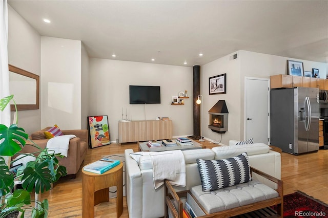 3225 Blake St Unit 4, Denver, CO 80205 - living room with light wood-style floors and recessed lighting