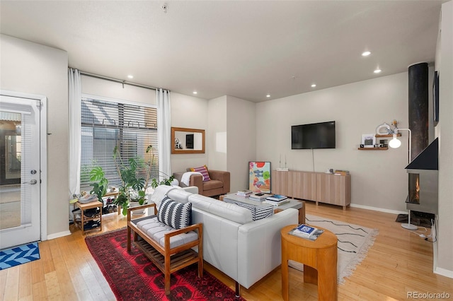3225 Blake St Unit 4, Denver, CO 80205 - living room featuring light wood-style flooring and recessed lighting