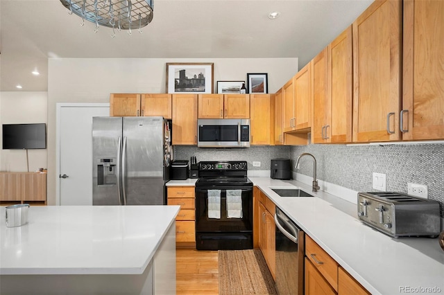 3225 Blake St Unit 4, Denver, CO 80205 - kitchen featuring appliances with stainless steel finishes, light countertops, tasteful backsplash, light wood finished floors, and recessed lighting