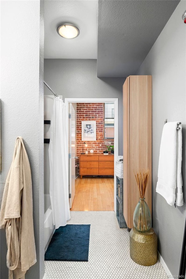 3225 Blake St Unit 4, Denver, CO 80205 - bathroom with a textured ceiling and shower / bath combo