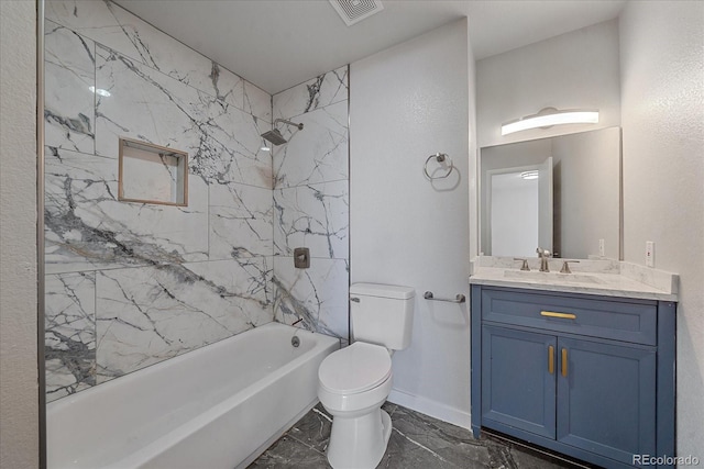 full bathroom with vanity, toilet, and tiled shower / bath